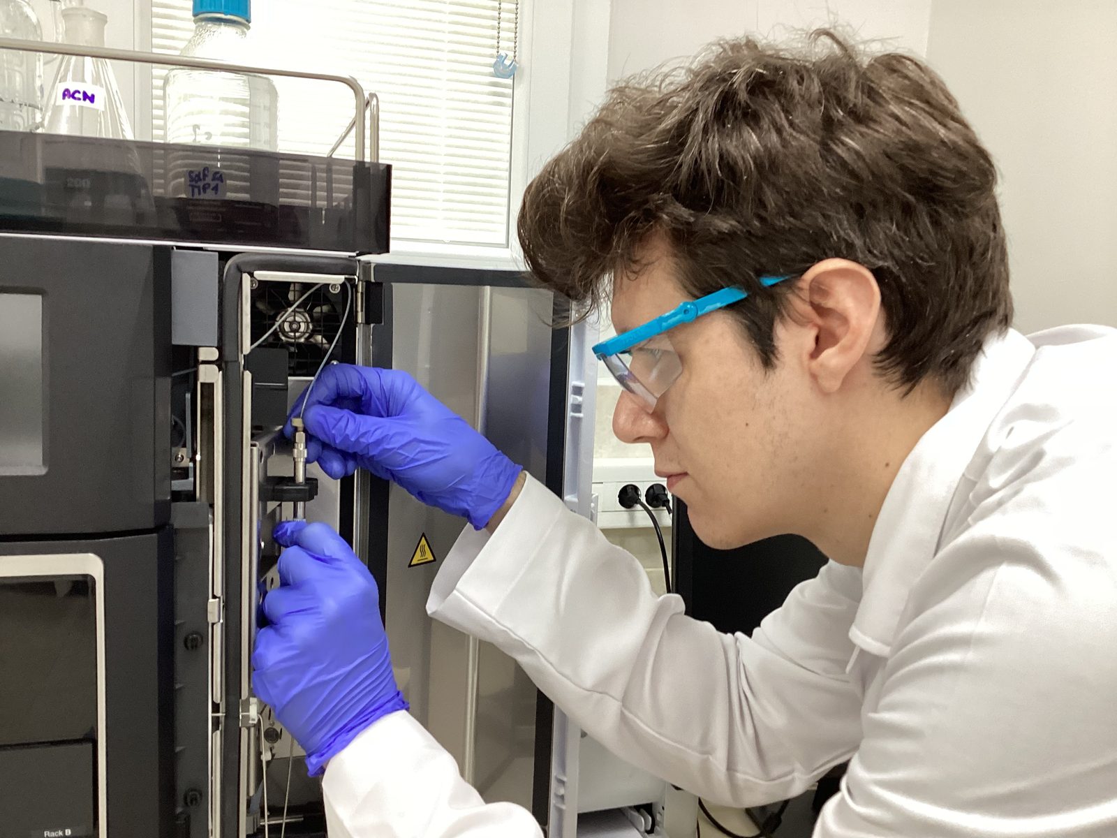 Analyst installing an HPLC column